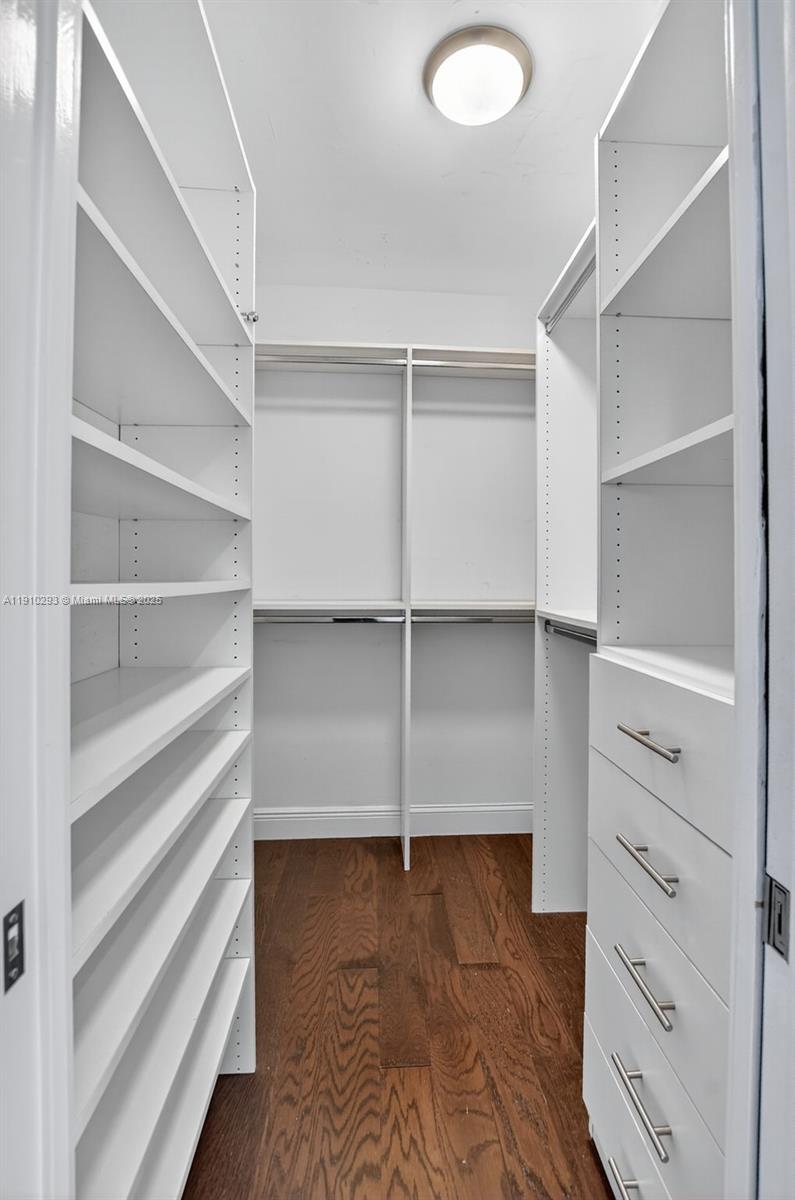 5660 Golfway Drive Boca Raton, FL 33433 - Photo 23 of 41 a view of an empty walk in closet