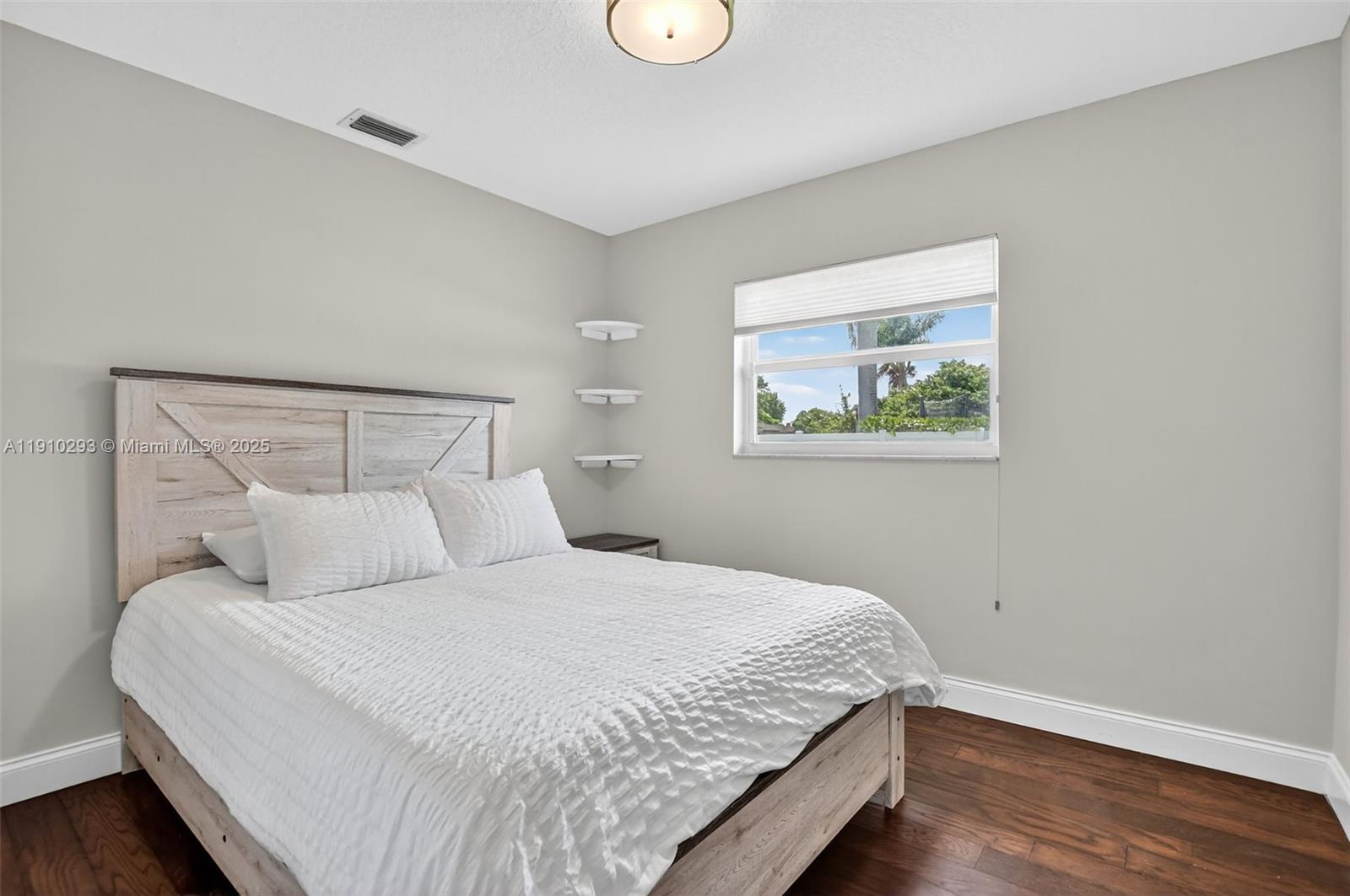 5660 Golfway Drive Boca Raton, FL 33433 - Photo 24 of 41 a bedroom with a bed and a window