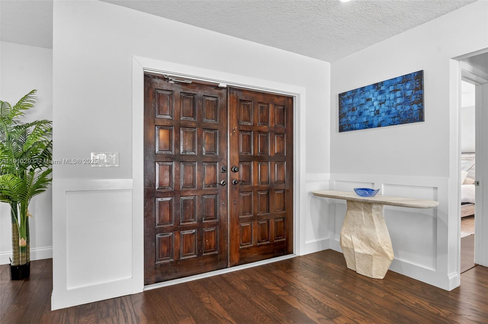 5660 Golfway Drive Boca Raton, FL 33433 - Photo 4 of 41 a view of an empty room with wooden floor and a window