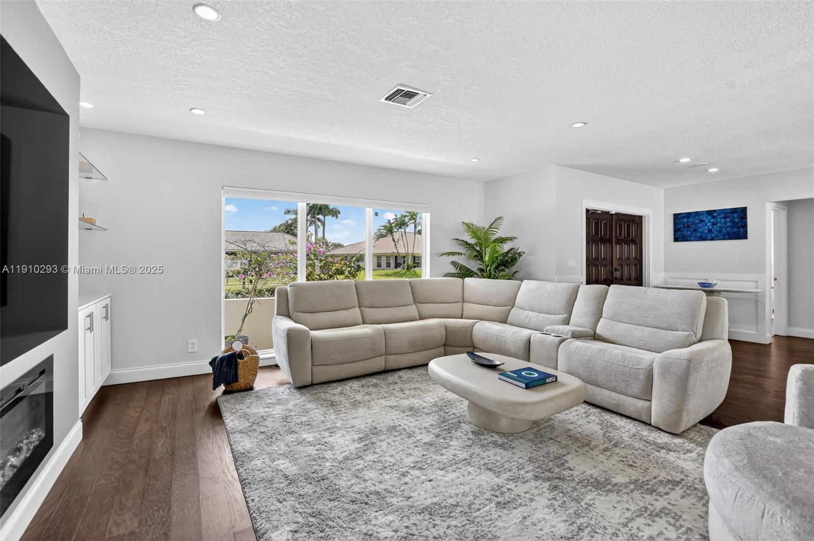 5660 Golfway Drive Boca Raton, FL 33433 - Photo 6 of 41 a living room with furniture and a flat screen tv