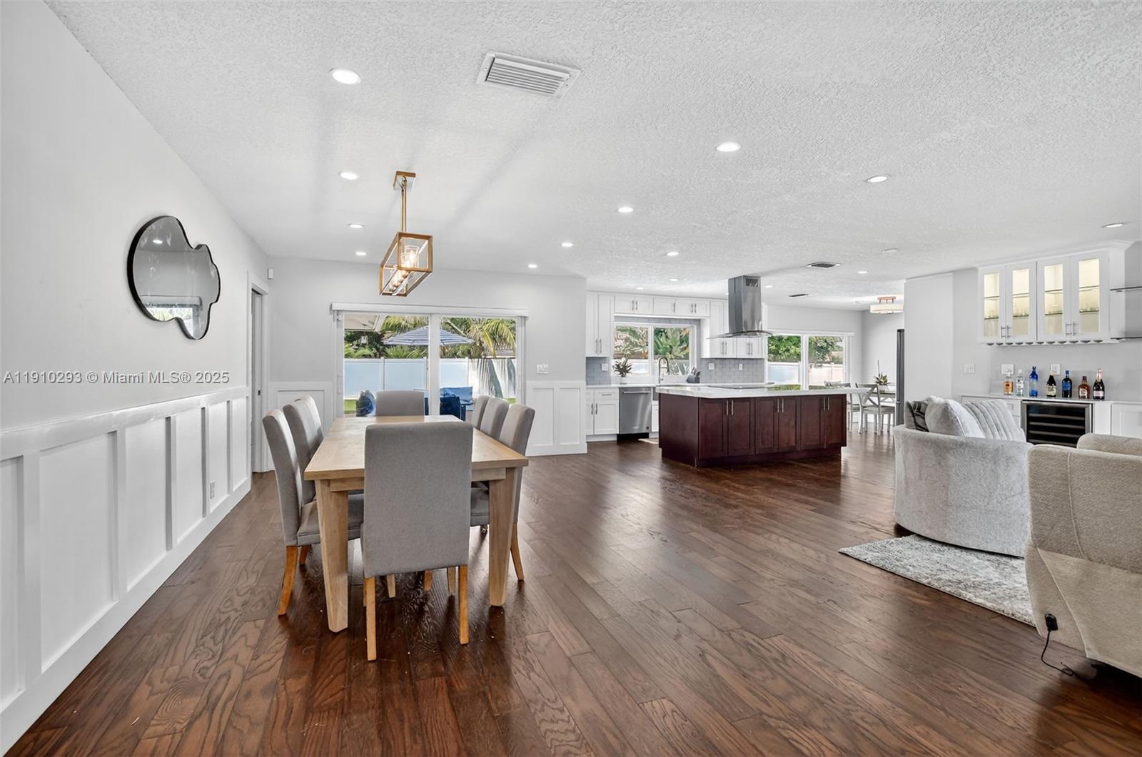 5660 Golfway Drive Boca Raton, FL 33433 - Photo 8 of 41 a view of kitchen and dining room with wooden floor