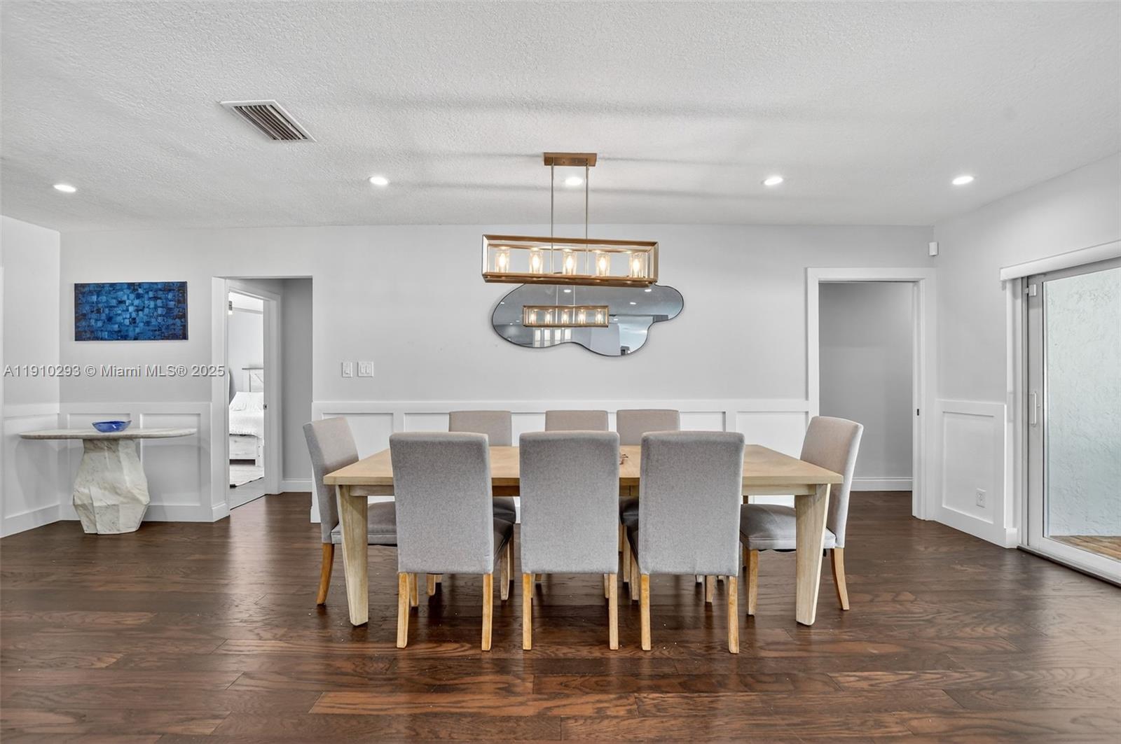 5660 Golfway Drive Boca Raton, FL 33433 - Photo 9 of 41 a view of a dining room with furniture and wooden floor