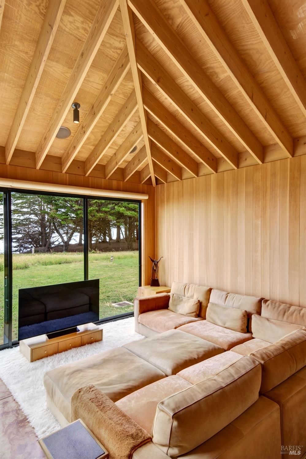 233 Solstice The Sea Ranch, CA 95497 - Photo 11 of 90 Living room features wood walls and open beam ceiling