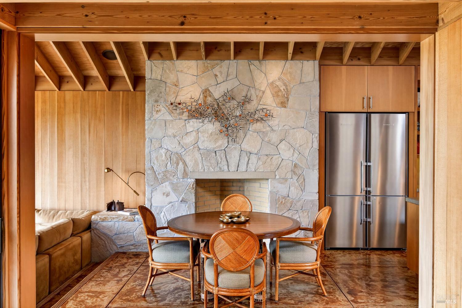 233 Solstice The Sea Ranch, CA 95497 - Photo 15 of 90 Dining room with Utah blonde stone wood burning fireplace