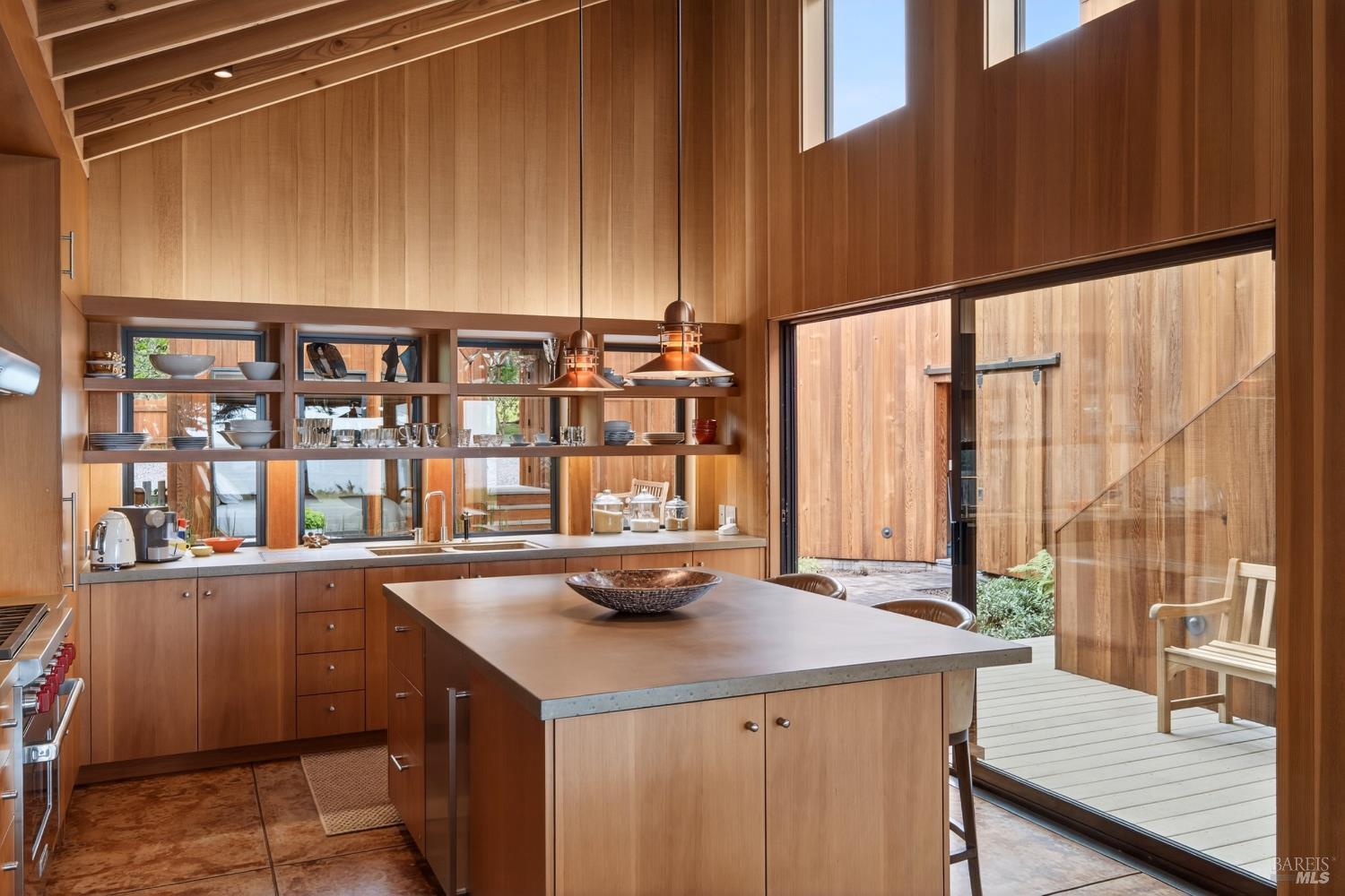 233 Solstice The Sea Ranch, CA 95497 - Photo 20 of 90 Kitchen with island drawers and wine cooler. Sliding glass doors open to courtyard.