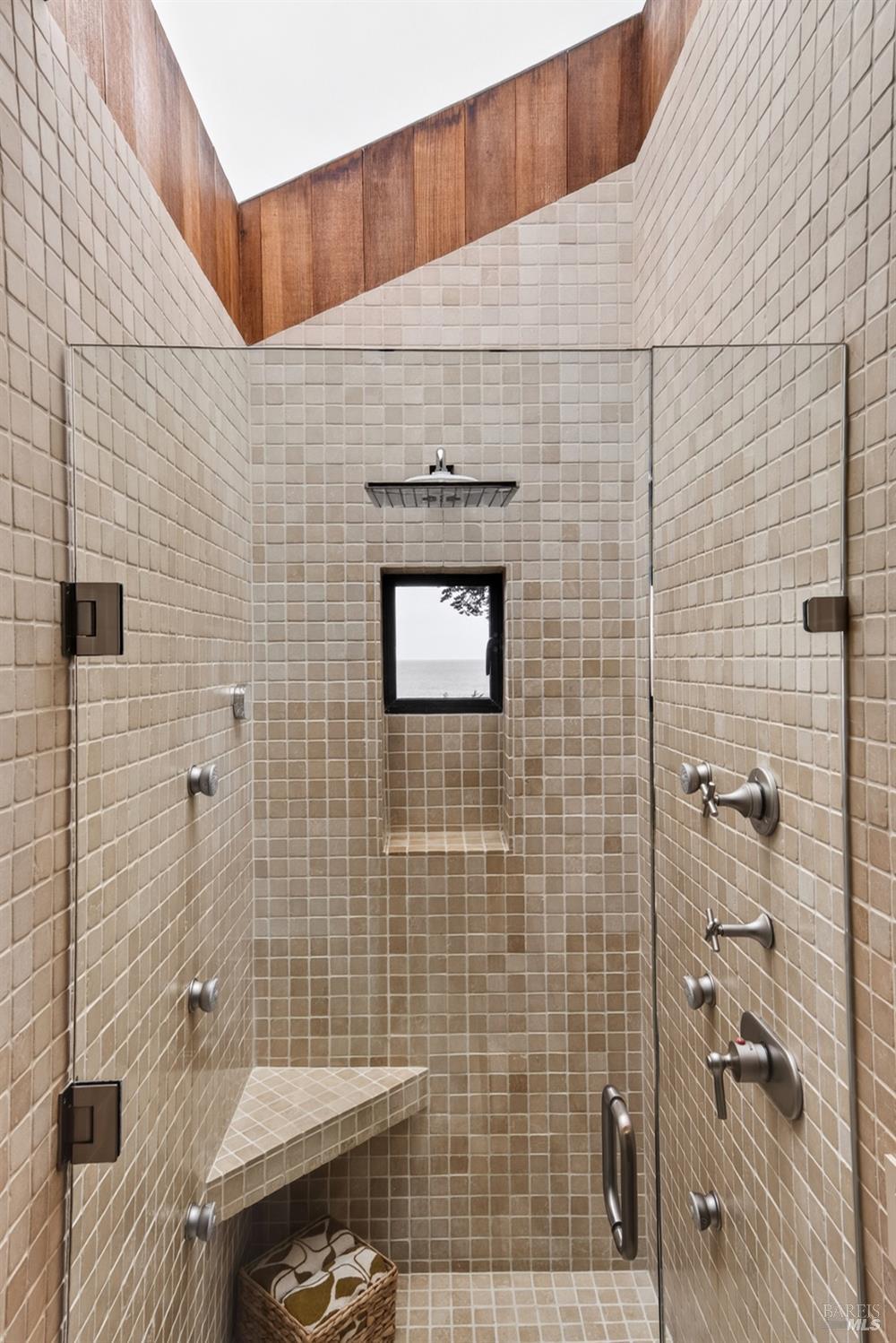 233 Solstice The Sea Ranch, CA 95497 - Photo 34 of 90 Tiled walk in shower with glass door, skylight and window with ocean view
