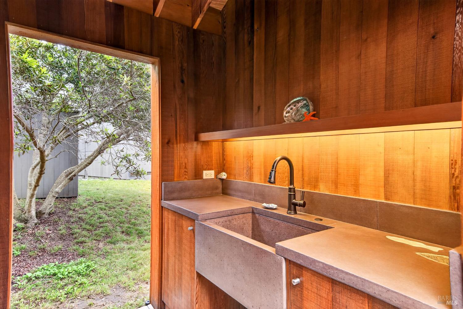 233 Solstice The Sea Ranch, CA 95497 - Photo 44 of 90 Garden shed with sink, cabinets and storage shelf.