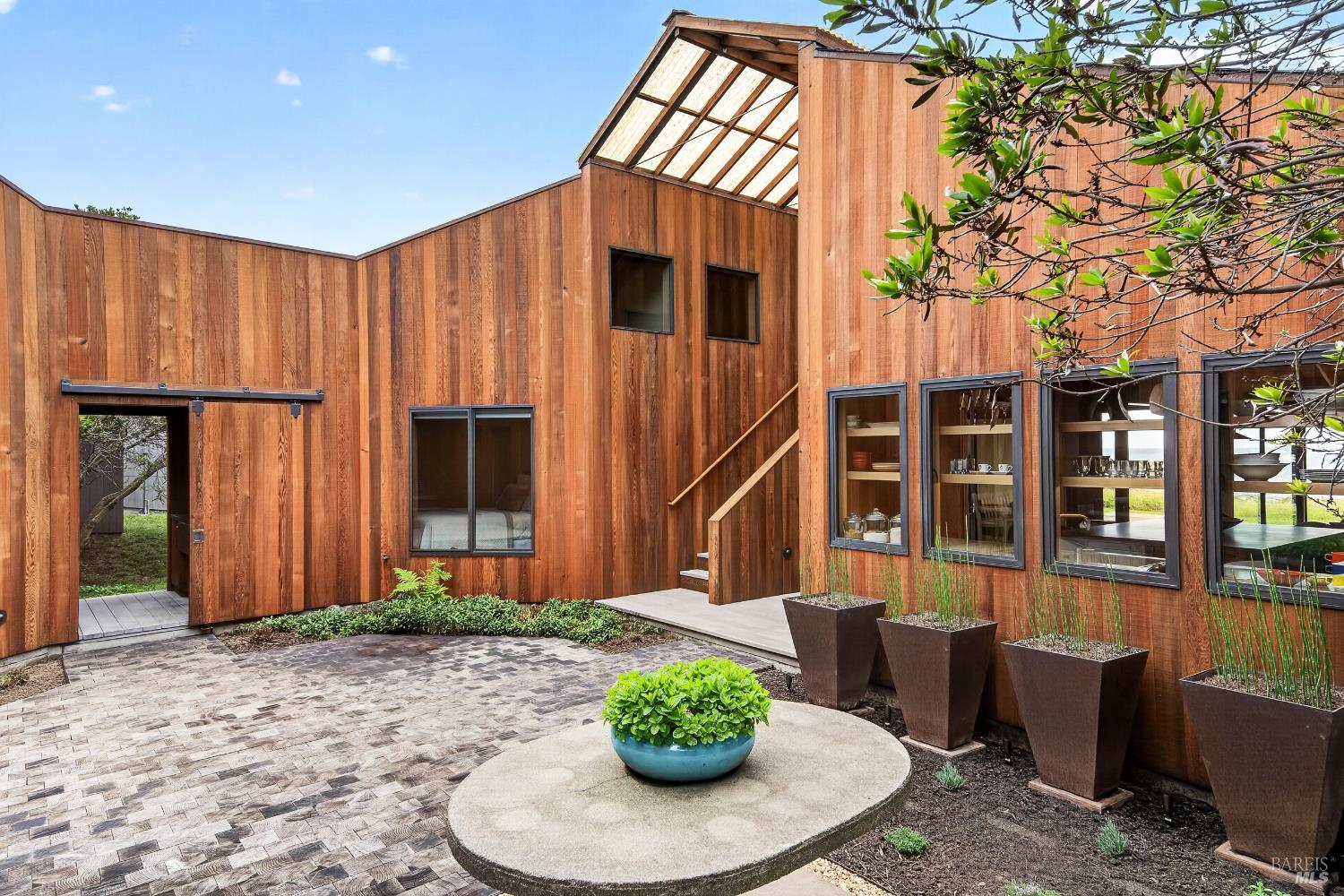 233 Solstice The Sea Ranch, CA 95497 - Photo 50 of 90 Courtyard looking to garden shed with sliding door