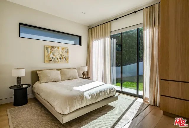 a bathroom with a tub a toilet and a shower