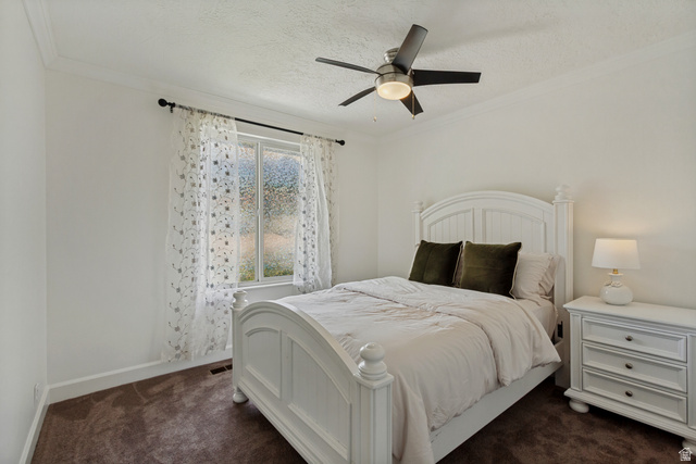 9706 Raintree Drive Sandy, UT 84092 - Photo 23 of 42 Recessed window with white trim, dark ceiling fan, and carpeted flooring