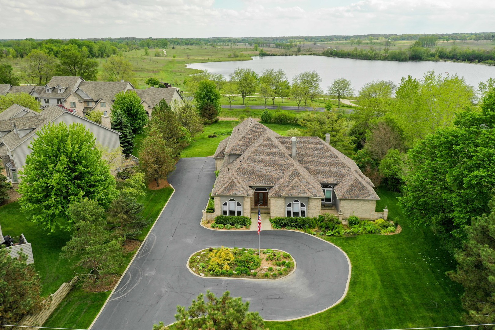 201 East Army Trail Road Bartlett, IL 60103 - Photo 2 of 59 an aerial view of a house with garden space and lake view