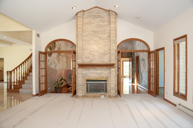 201 East Army Trail Road Bartlett, IL 60103 - Photo 18 of 59 an empty room with fireplace and windows