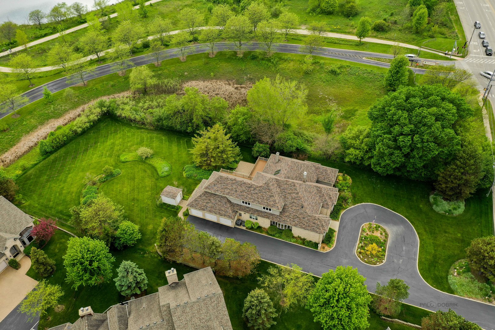 201 East Army Trail Road Bartlett, IL 60103 - Photo 3 of 59 an aerial view of a house with a garden and lake view