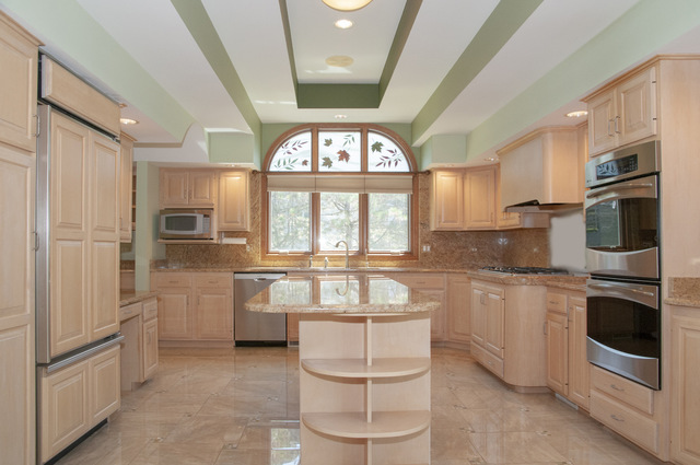 201 East Army Trail Road Bartlett, IL 60103 - Photo 23 of 59 a kitchen with stainless steel appliances granite countertop a refrigerator a stove a sink and a microwave