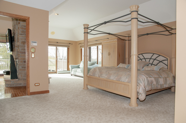 201 East Army Trail Road Bartlett, IL 60103 - Photo 27 of 59 a living room with a bed and a chandelier