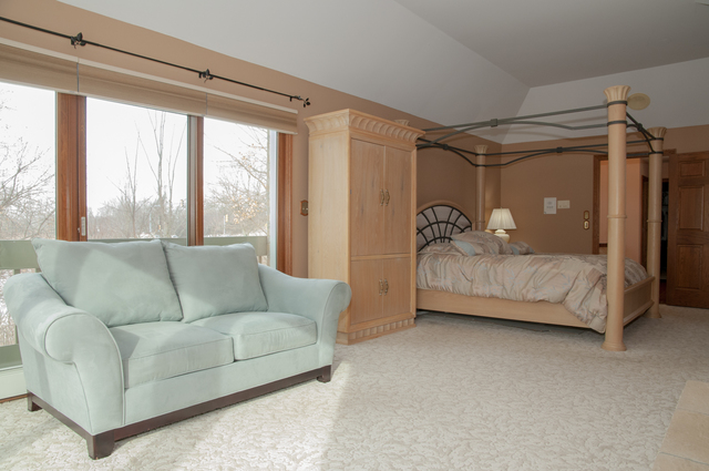 201 East Army Trail Road Bartlett, IL 60103 - Photo 28 of 59 a bedroom with furniture and a couch