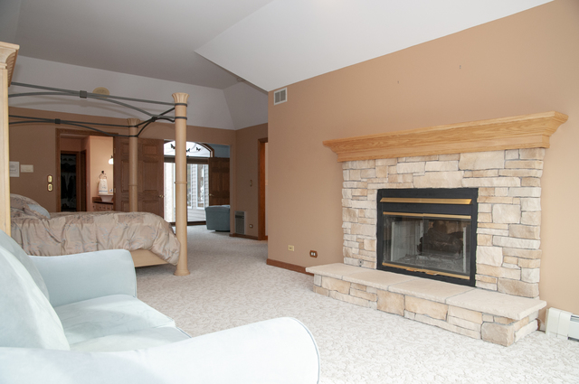 201 East Army Trail Road Bartlett, IL 60103 - Photo 29 of 59 a living room with furniture and a fireplace