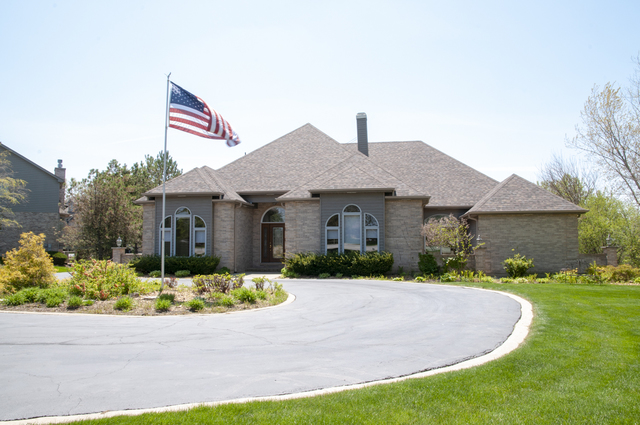 201 East Army Trail Road Bartlett, IL 60103 - Photo 4 of 59 a front view of a house with a yard