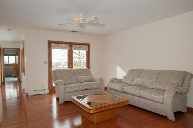 201 East Army Trail Road Bartlett, IL 60103 - Photo 37 of 59 a living room with furniture and wooden floor