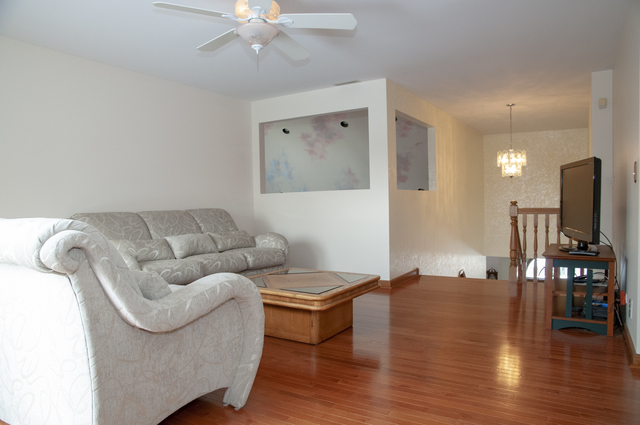201 East Army Trail Road Bartlett, IL 60103 - Photo 38 of 59 a living room with furniture and wooden floor