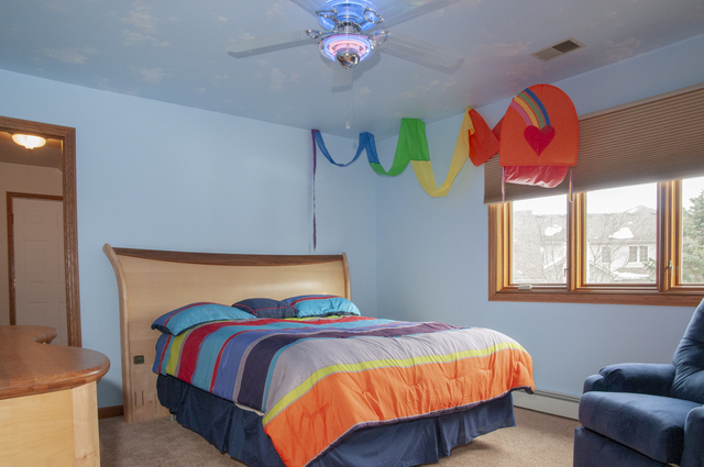 201 East Army Trail Road Bartlett, IL 60103 - Photo 39 of 59 a bedroom with a bed and chandelier