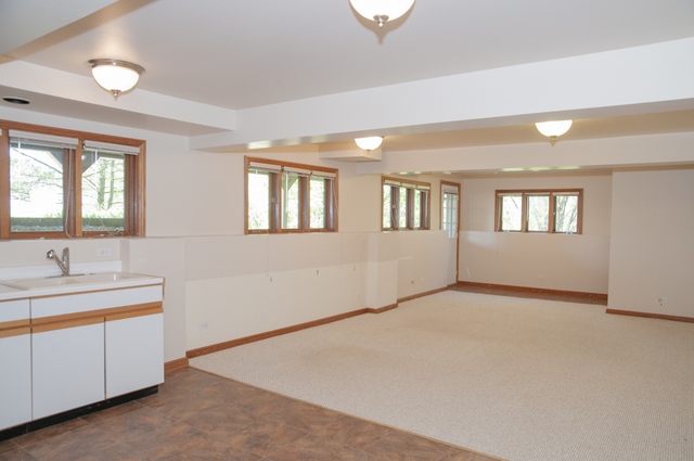 201 East Army Trail Road Bartlett, IL 60103 - Photo 52 of 59 a view of an empty room with a sink and a window