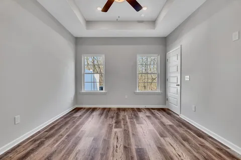 a view of room with window and hardwood floor