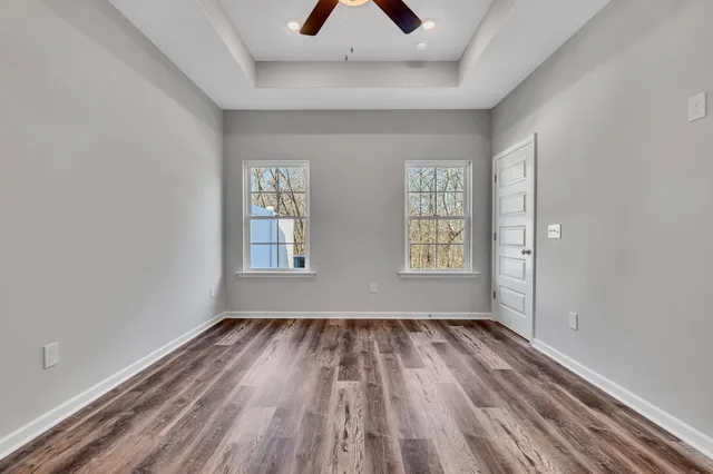a view of room with window and hardwood floor
