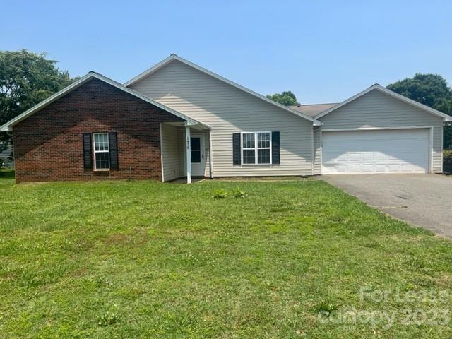 a front view of a house with yard