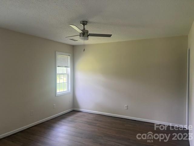 176 Oak Tree Road Mooresville, NC 28117 - Photo 12 of 14 an empty room with wooden floor closet and windows