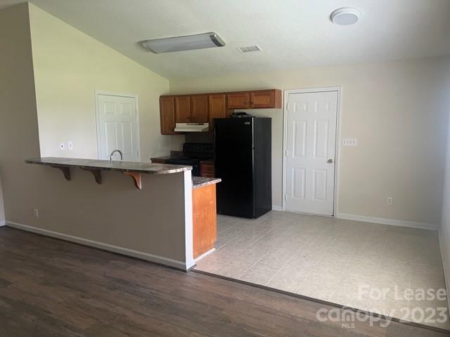 176 Oak Tree Road Mooresville, NC 28117 - Photo 2 of 14 a kitchen with stainless steel appliances granite countertop a refrigerator and a stove
