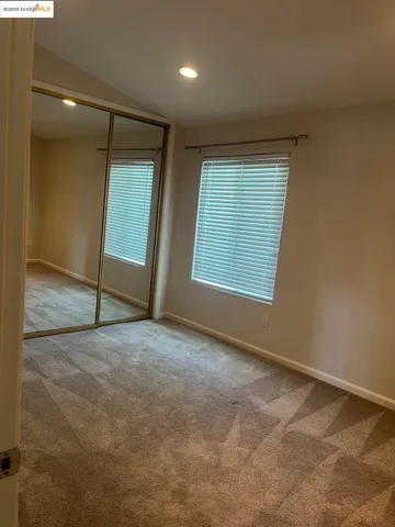 a bathroom with a double vanity sink and mirror
