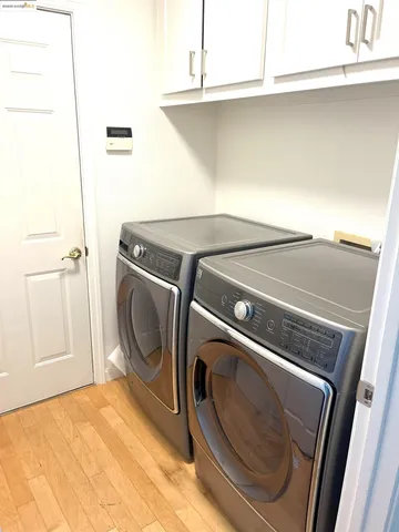 a view of balcony with wooden floor and outdoor seating