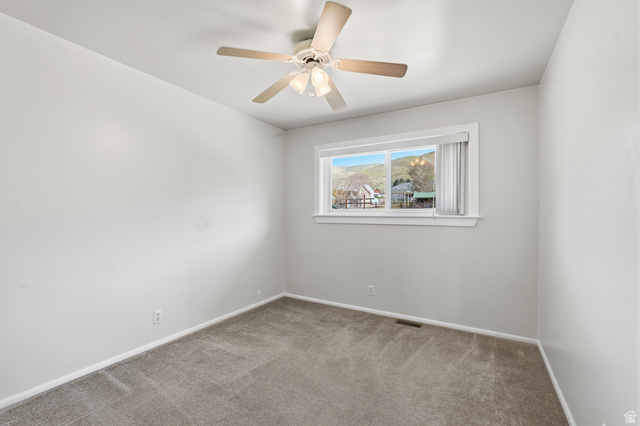 2420 West Old Hwy Road Morgan, UT 84050 - Photo 24 of 54 Carpeted spare room with baseboards and a ceiling fan