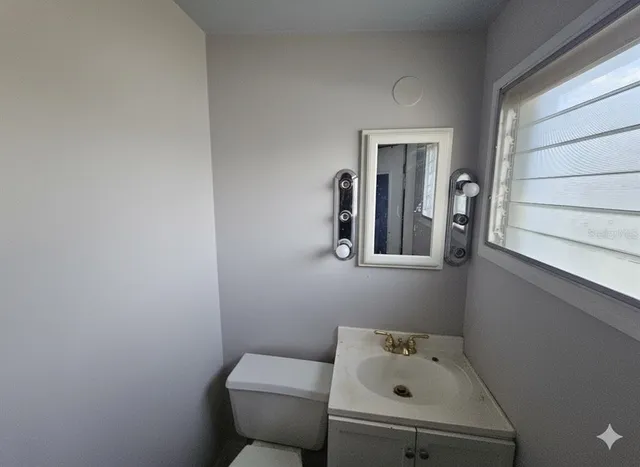 a bathroom with a sink and a toilet