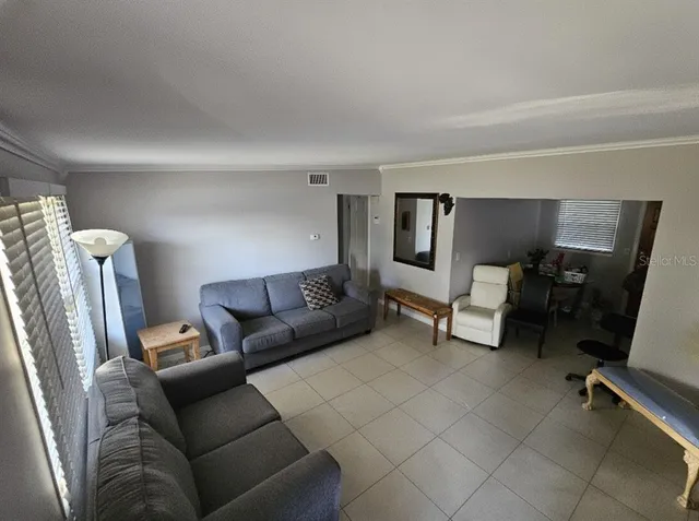 a living room with furniture and a couch