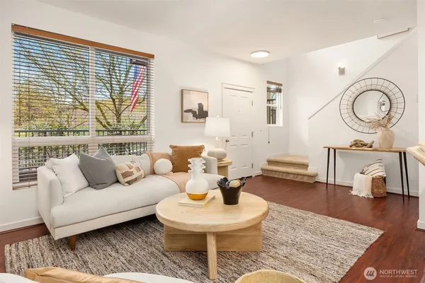 a living room with furniture and a large window