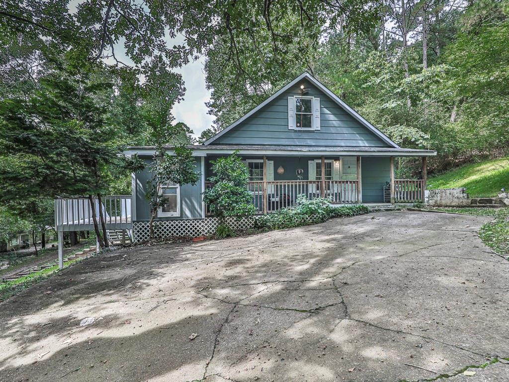 418 Lower Scott Mill Road Canton, GA 30115 - Photo 1 of 1 a front view of a house with garden