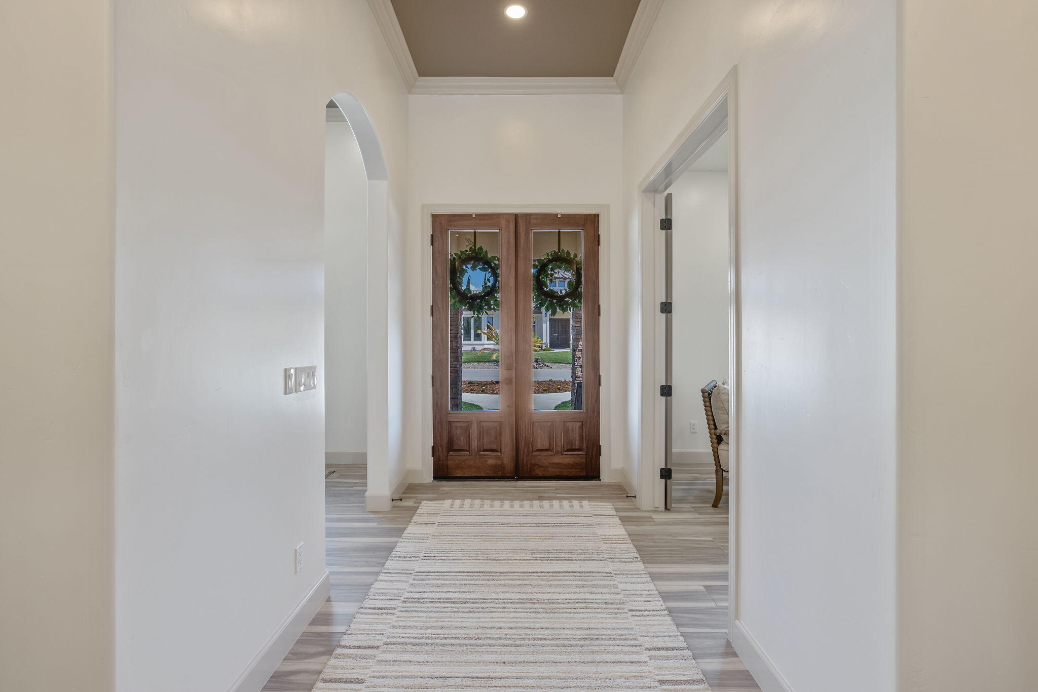 503 East Palm Street Exeter, CA 93221 - Photo 9 of 92 a view of a hallway with wooden floor and a bathroom