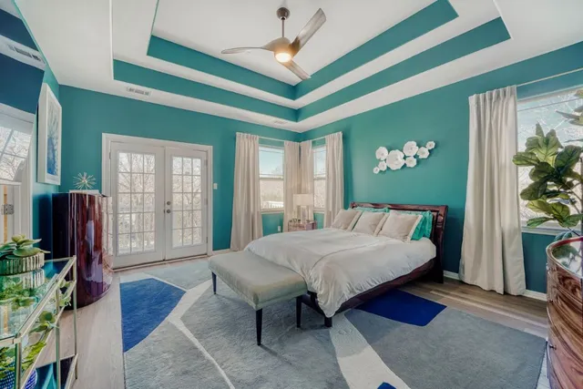 a bedroom with windows