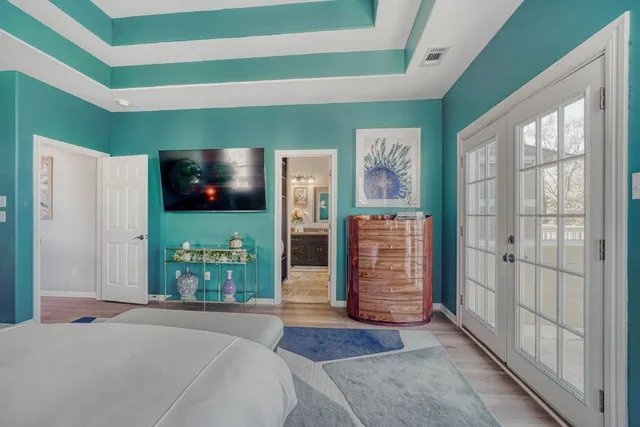 a spacious bathroom with a granite countertop sink a mirror and a shower