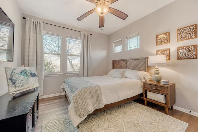 a bathroom with a granite countertop toilet sink and shower