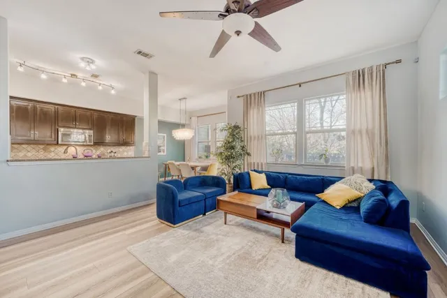 a living room with furniture and a window