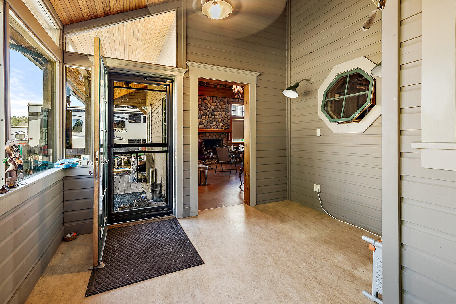4450 Fern Valley Road Medford, OR 97504 - Photo 59 of 74 a view of a hallway with wooden floor and dining room