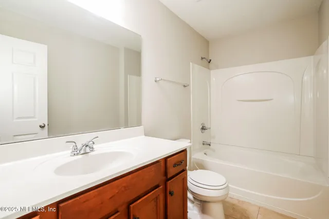 a bathroom with a sink a toilet and a bathtub