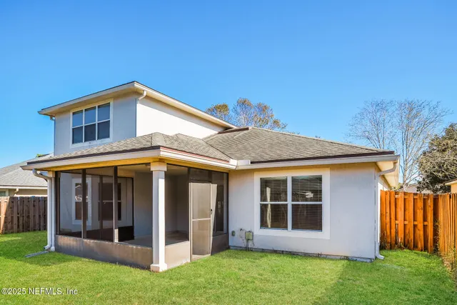 a view of front of house with a yard
