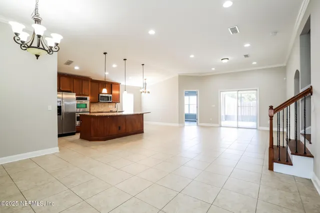 a view of a kitchen with furniture and a chandelier