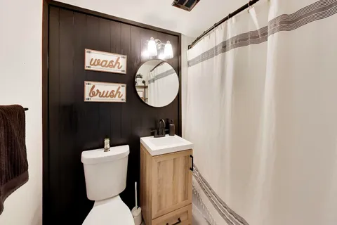 a bathroom with a toilet and a sink