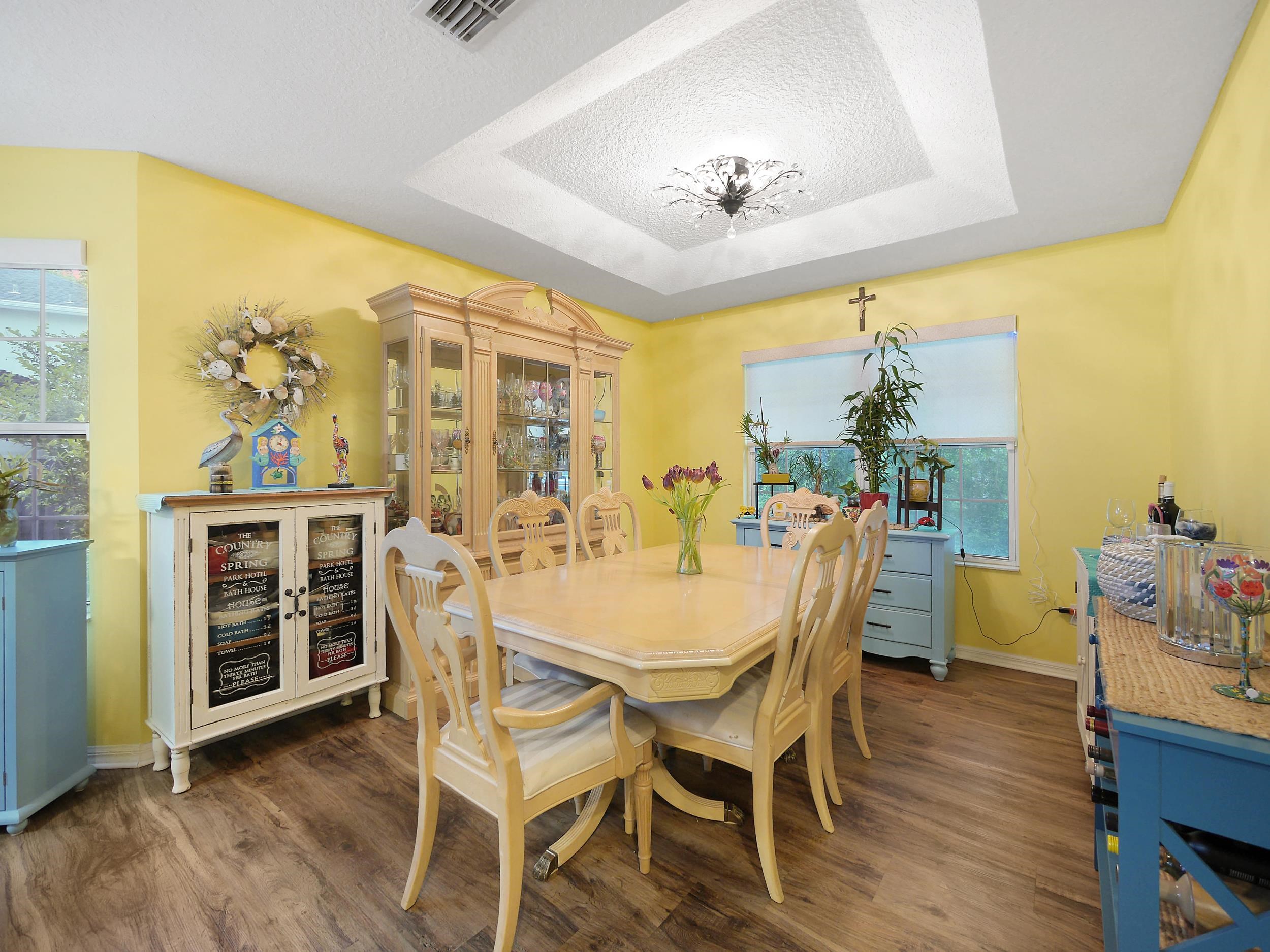 549 Willow Walk Place St. Augustine, FL 32086 - Photo 11 of 32 a view of a dining room with furniture and chandelier