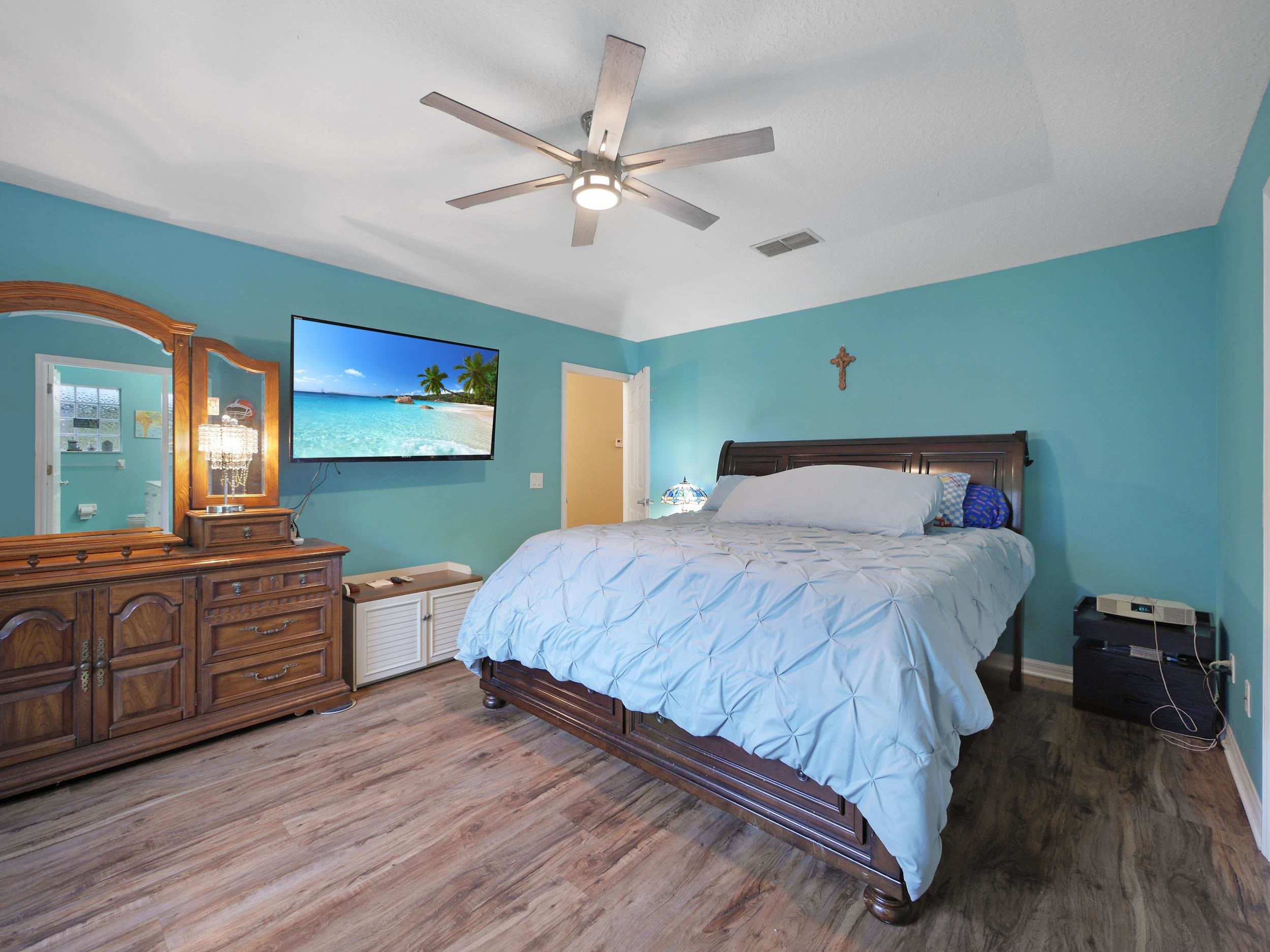 549 Willow Walk Place St. Augustine, FL 32086 - Photo 13 of 32 a bedroom with a bed and a dresser